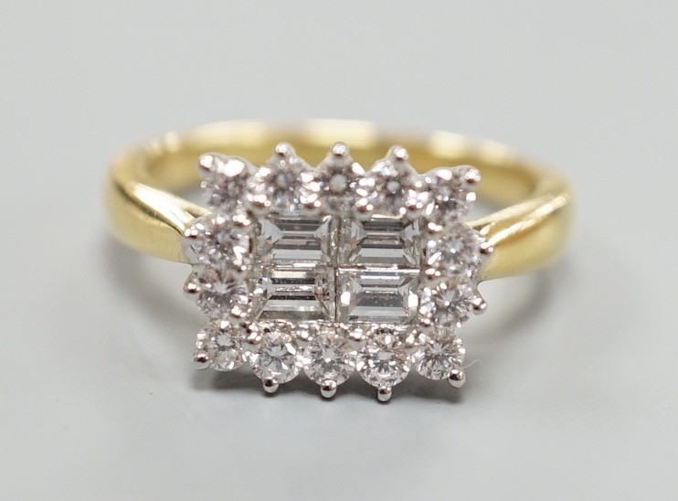 A 750 yellow metal, baguette and round cut diamond set rectangular cluster ring, size M, gross weight 4.8 grams.